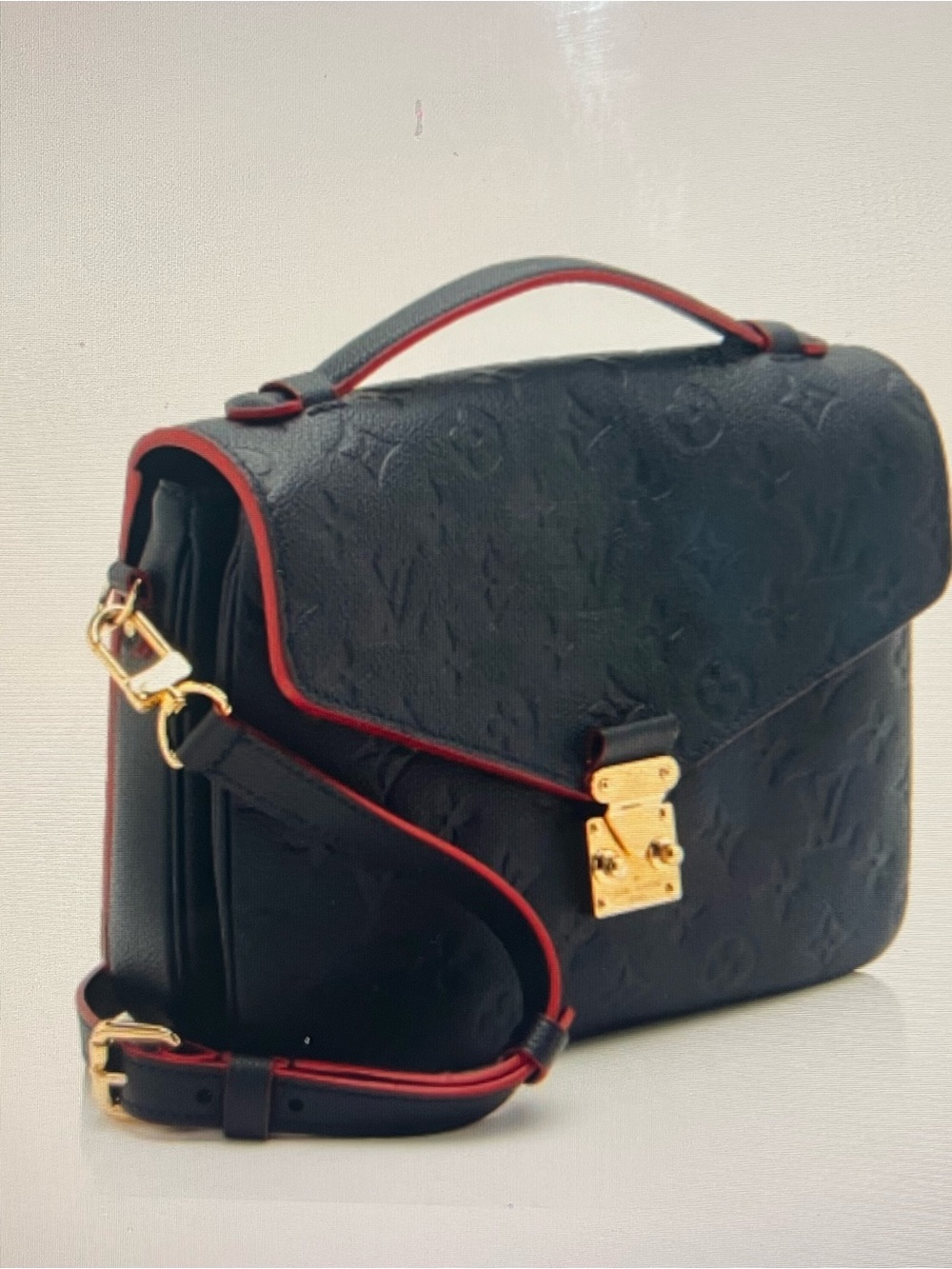 Louis Vuitton Pochette Métis Empreinte leather with Red Trim and Gold Hardware